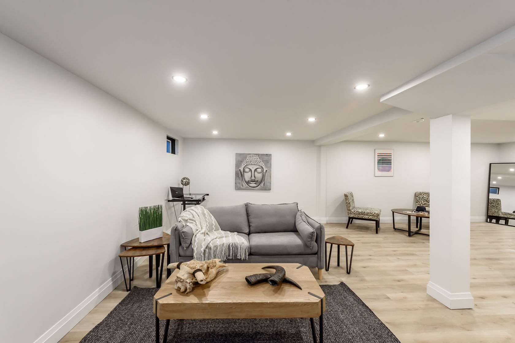 Beautifully finished basement with professional staging, warm lighting, and modern design — premium portfolio shot — Gateshead, Hamilton | MTC Renovations